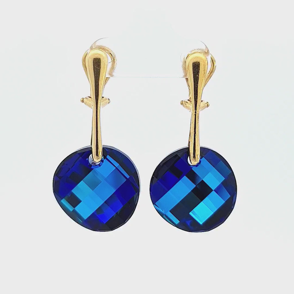Video showcasing the sparkling facets of the Symphony of the Seas Gold Twist Clip-On Earrings with Bermuda Blue Austrian Crystals