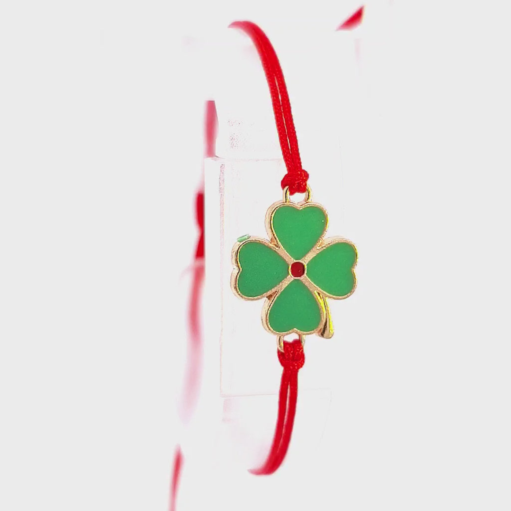 Promotional video of the 'Clover Wishes' Martisor Bracelet, highlighting the adjustable feature of the red macramé cord and the vibrant enamel clover charm.