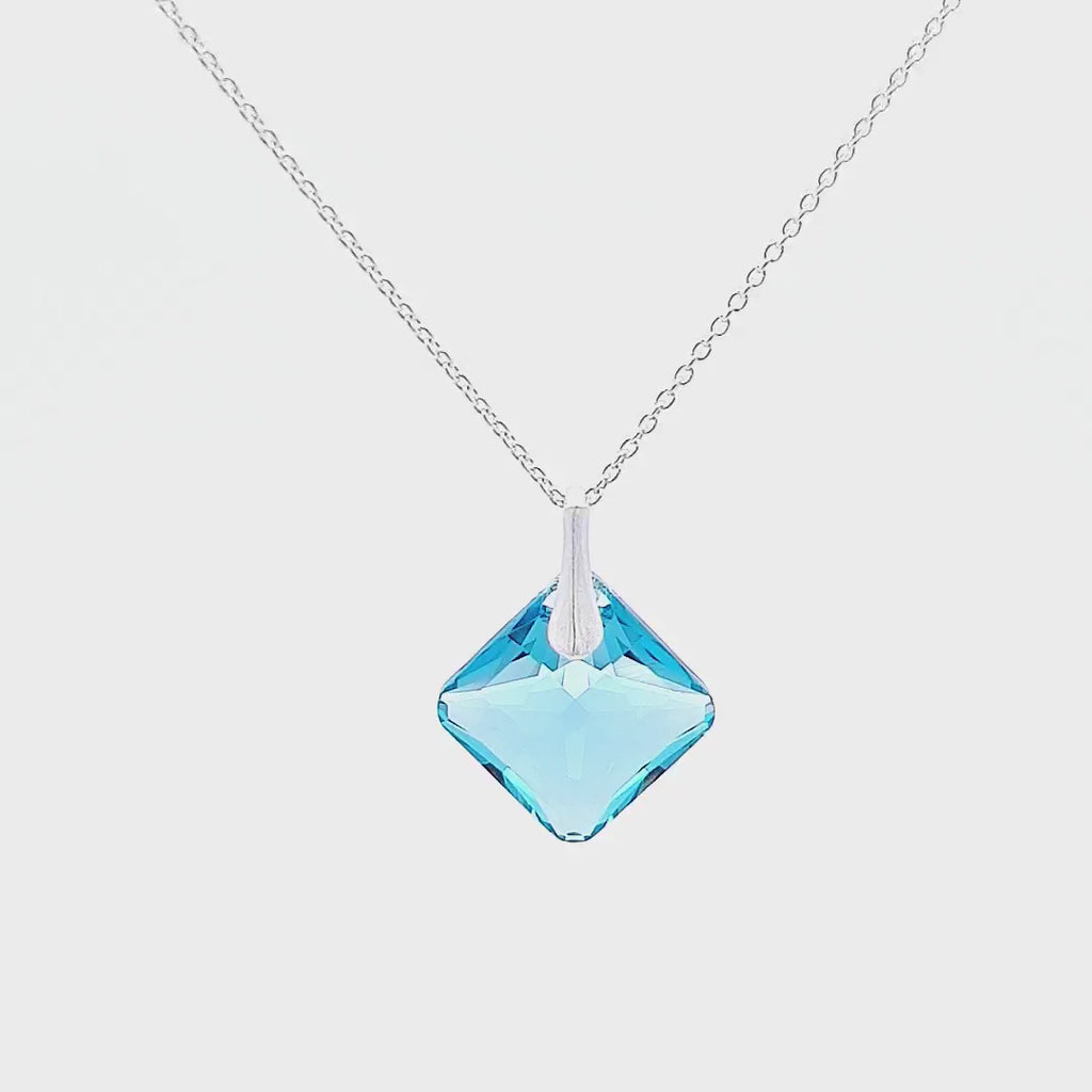 360-degree view of the Princess Cut Square March Aquamarine Birthstone Crystal Pendant Necklace, a symbol of personal journeys.