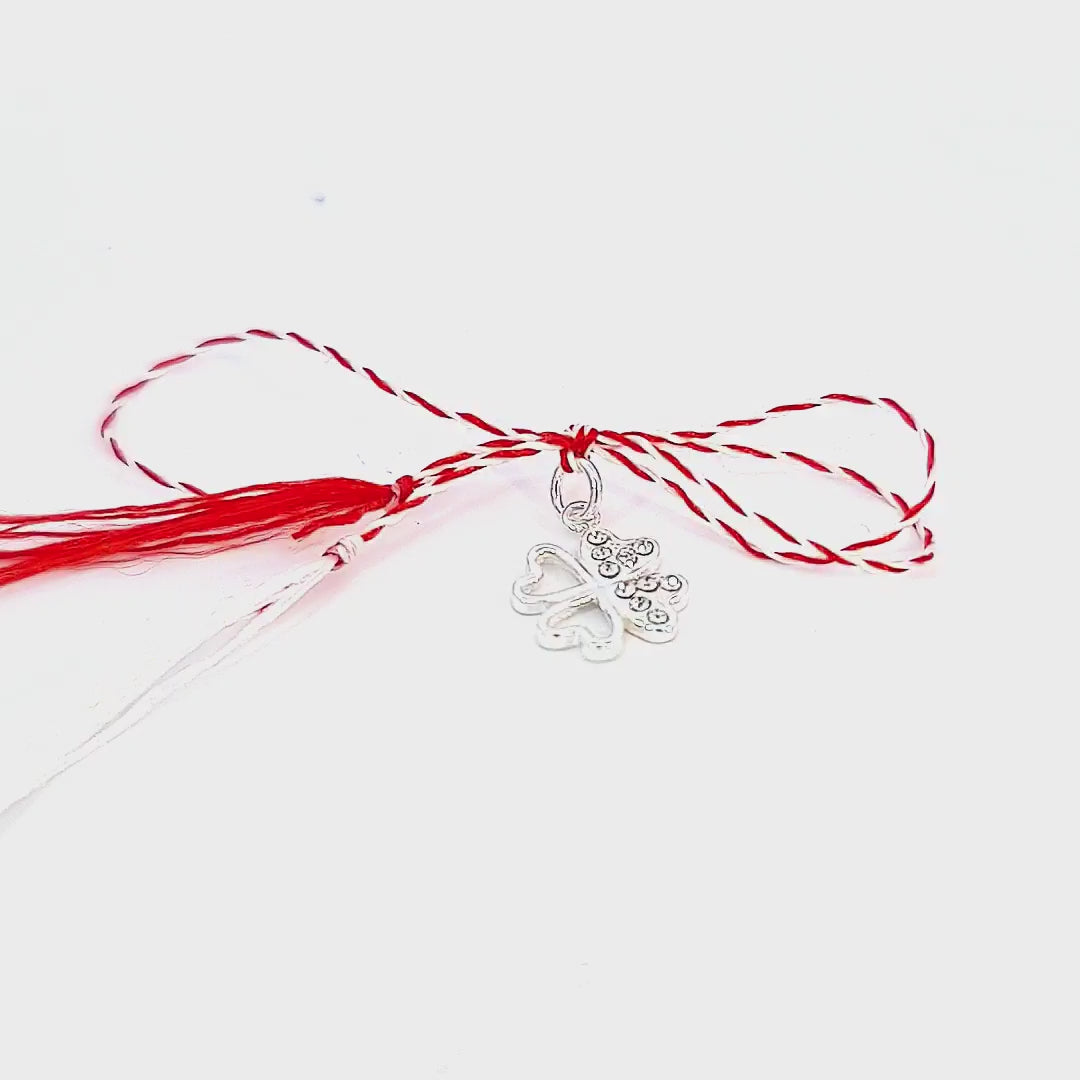 Revealing the charm of the Fortune's Favour Mărțișor Pendant, this video captures the sterling silver clover's allure, the traditional red and white string, and the storytelling card, all from Magpie Gems in Ireland.