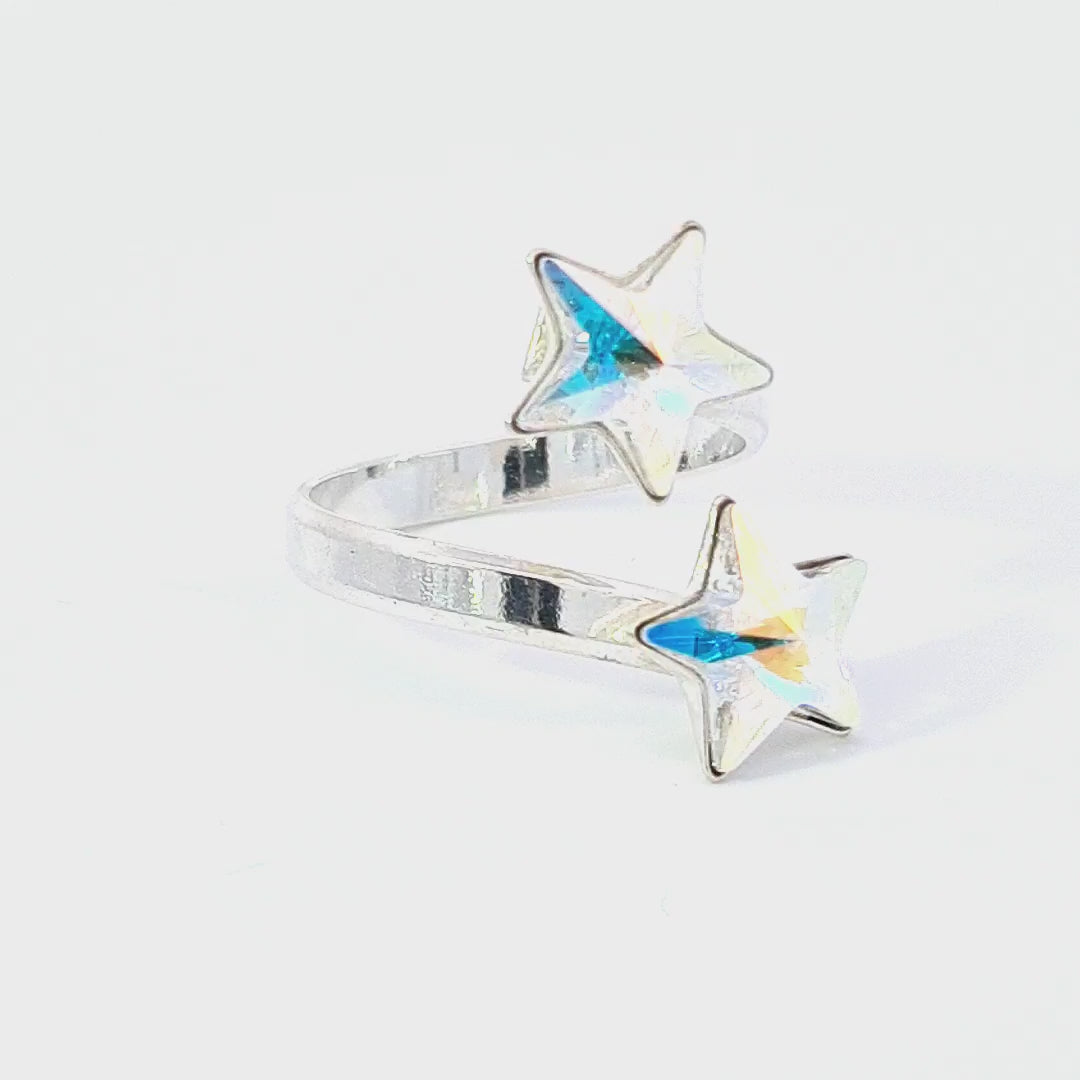 Interactive video of the Gemini Stars Ring, revealing the shifting colours of the Crystal AB Star Crystals in Sterling Silver - Magpie Gems Ireland