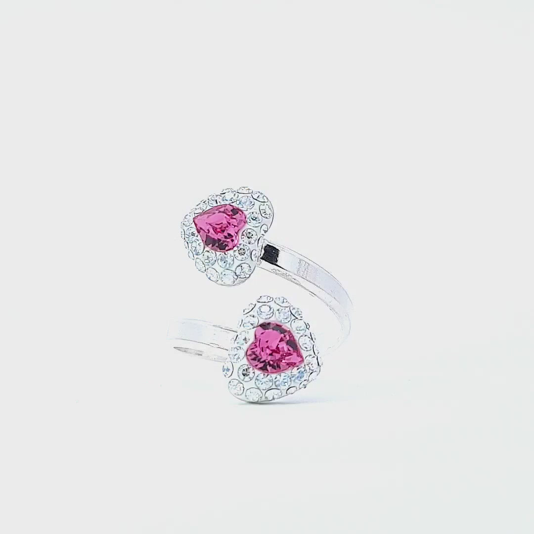 Handcrafted wrap-around ring featuring rose pink heart pave ends and vibrant gemstones, perfect for adding flair to any outfit.