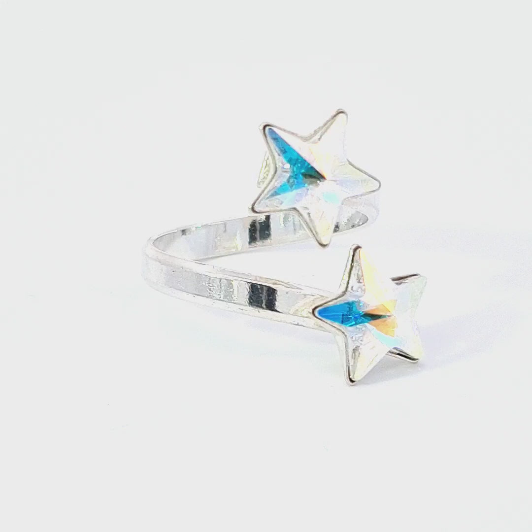 Interactive video of the Gemini Stars Ring, revealing the shifting colours of the Crystal AB Star Crystals in Sterling Silver - Magpie Gems Ireland