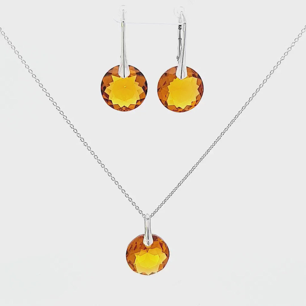Video display of November Elegance Topaz Jewellery Set reflecting light and showcasing the beauty of the Topaz crystal.