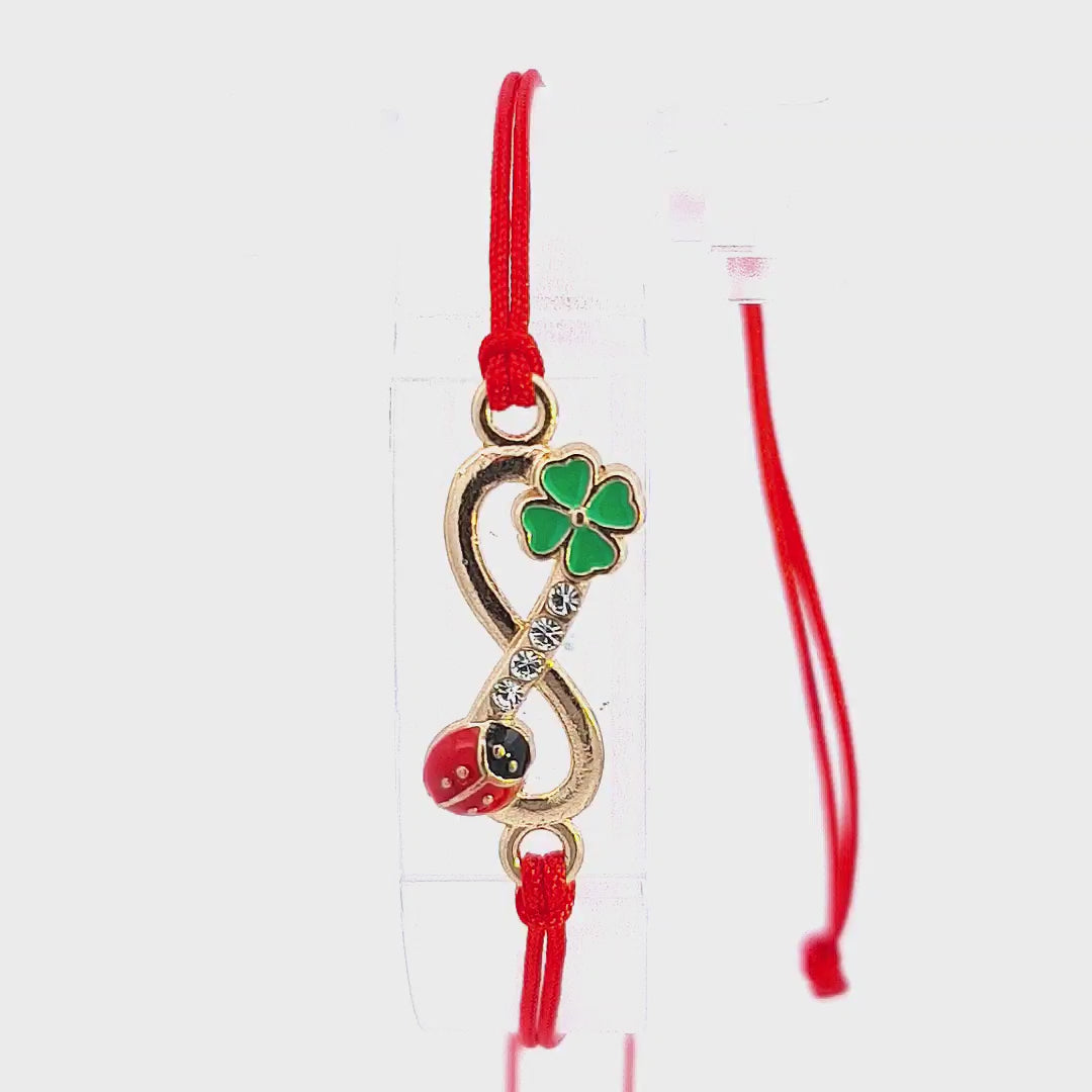 Video featuring the 'Eternal Luck' Martisor Bracelet, demonstrating the charm's intricate details and the slip knot functionality of the red macramé cord.