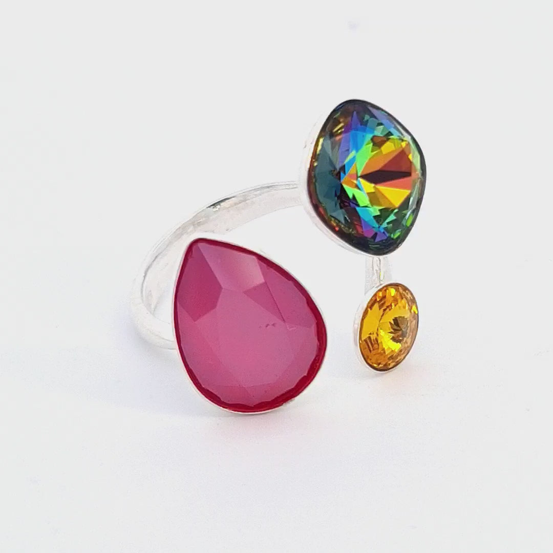 Showcasing the captivating colours of the Spectrum Splendour Adjustable Ring by Magpie Gems, featuring multi-coloured crystals.