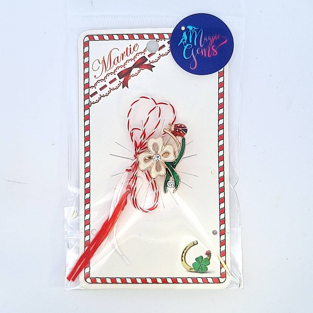 Packaged the 'Springtime Bloom' Martisor brooch presented with the red and white string, symbolising the Martisor tradition, with card and clear bag.