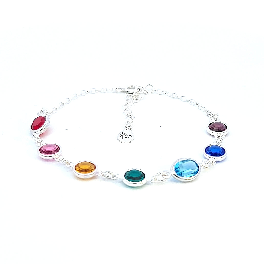 A close-up view of the Rainbow of Hope Crystal Silver Bracelet, featuring seven vibrant crystals representing a spectrum of colors. This beautiful bracelet symbolizes hope, unity, and empowerment for women, making it a meaningful accessory for any occasion.