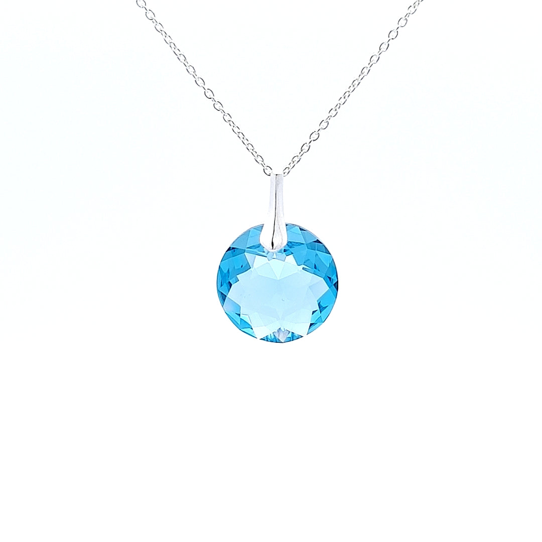 Close-up view of Round Birthstone Crystal Pendant Necklace in Sterling Silver with March Aquamarine