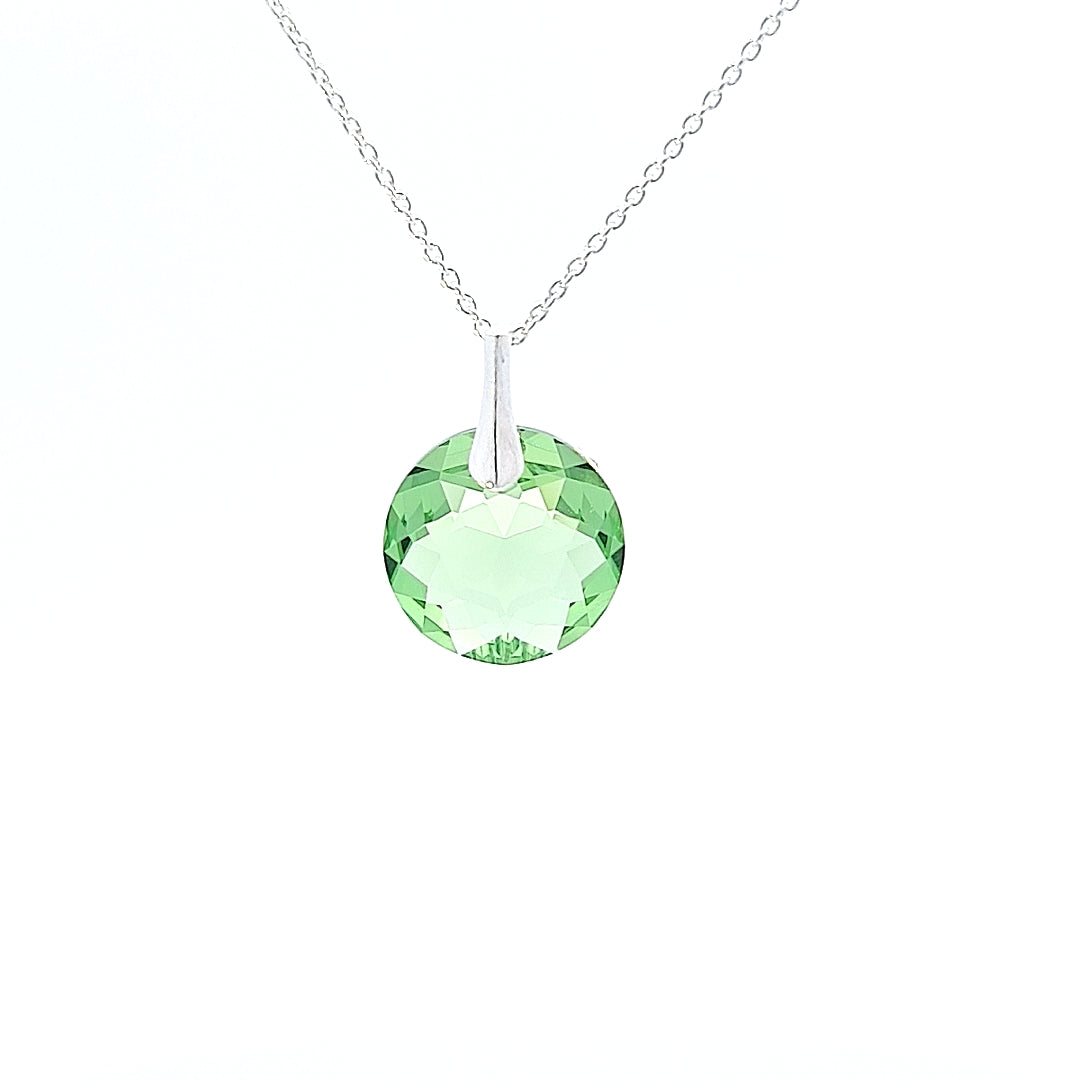 Close-up view of Round Birthstone Crystal Pendant Necklace in Sterling Silver with August Peridot Lime green