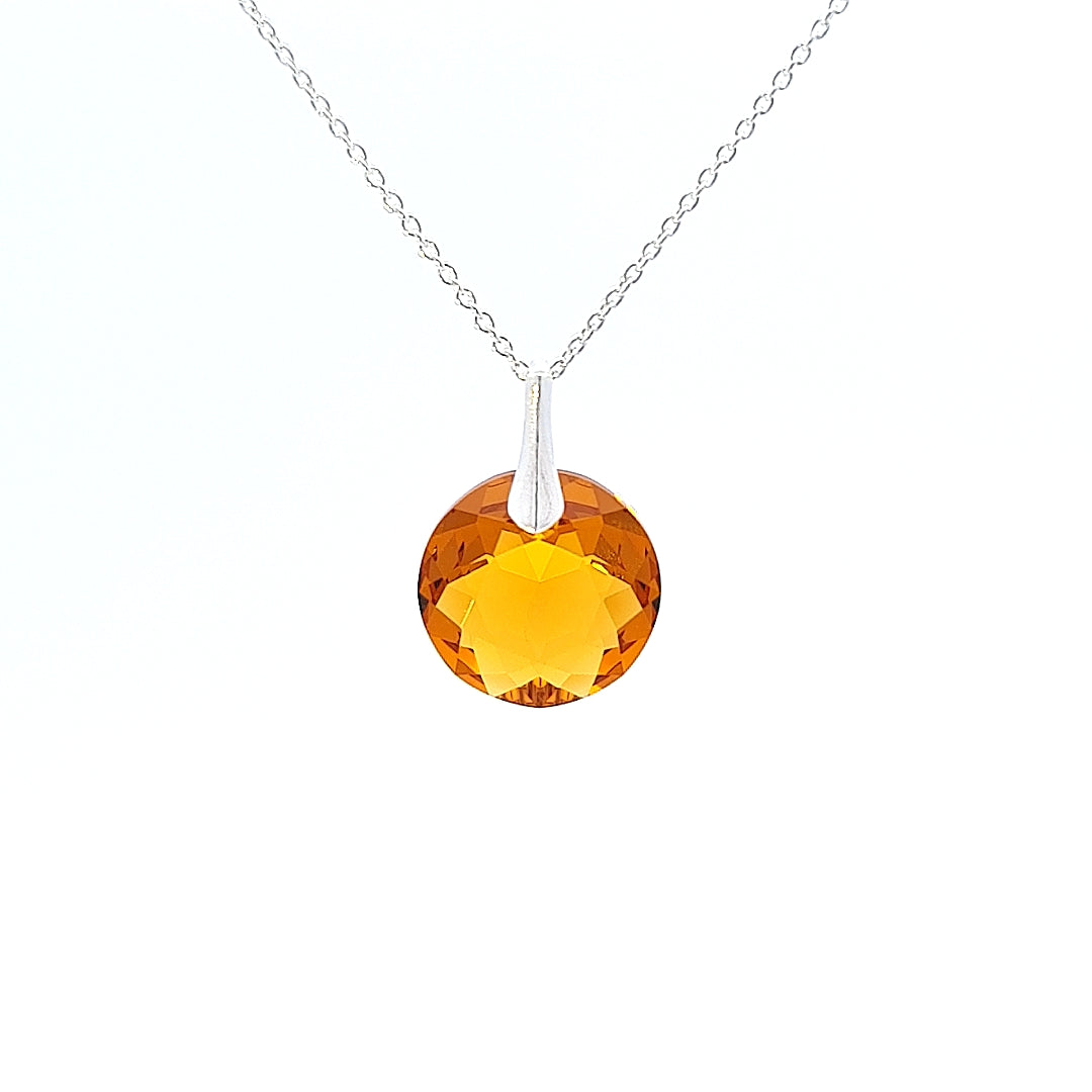Close-up view of Round Birthstone Crystal Pendant Necklace in Sterling Silver with Novemver Topaz
