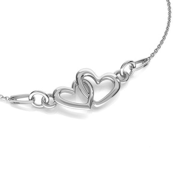 Sterling silver Two Hearts as One necklace with double heart pendant on clean white background, made in Ireland by Magpie Gems. 