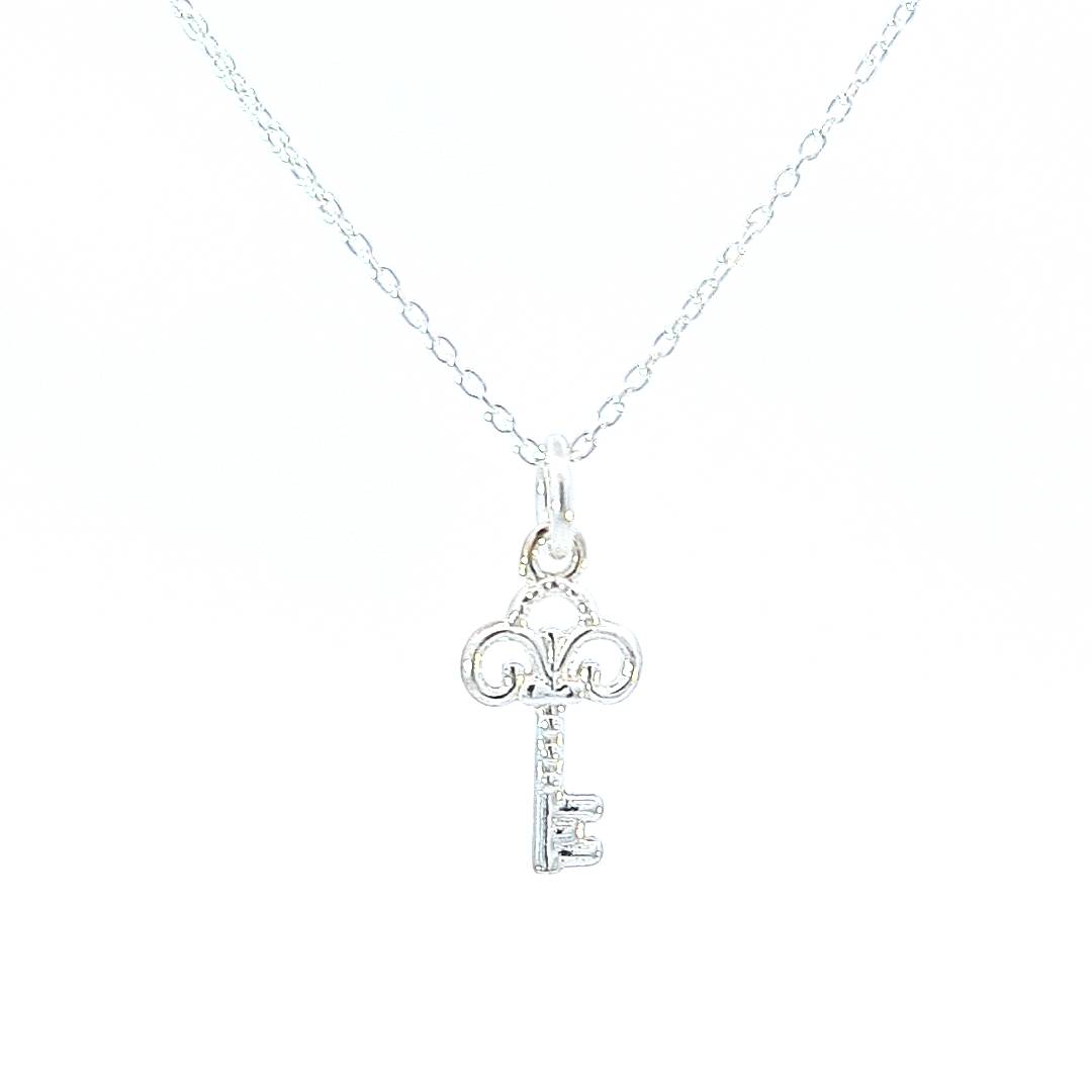 A close-up of a sterling silver key pendant necklace. Ambition & Success Key Necklace - Personalised Sterling Silver Jewellery Ireland. Birthstone necklace. Shop Local Ireland - Ireland