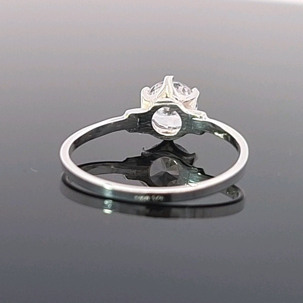 Detailed underside view of sterling silver solitaire ring with raised cubic zirconia setting, hypoallergenic and handcrafted in Ireland.