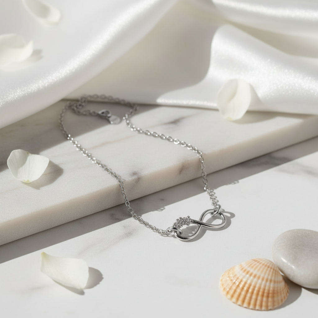 Silver anklet with an infinity with three flowers and fine chain, made by Magpie Gems in Ireland