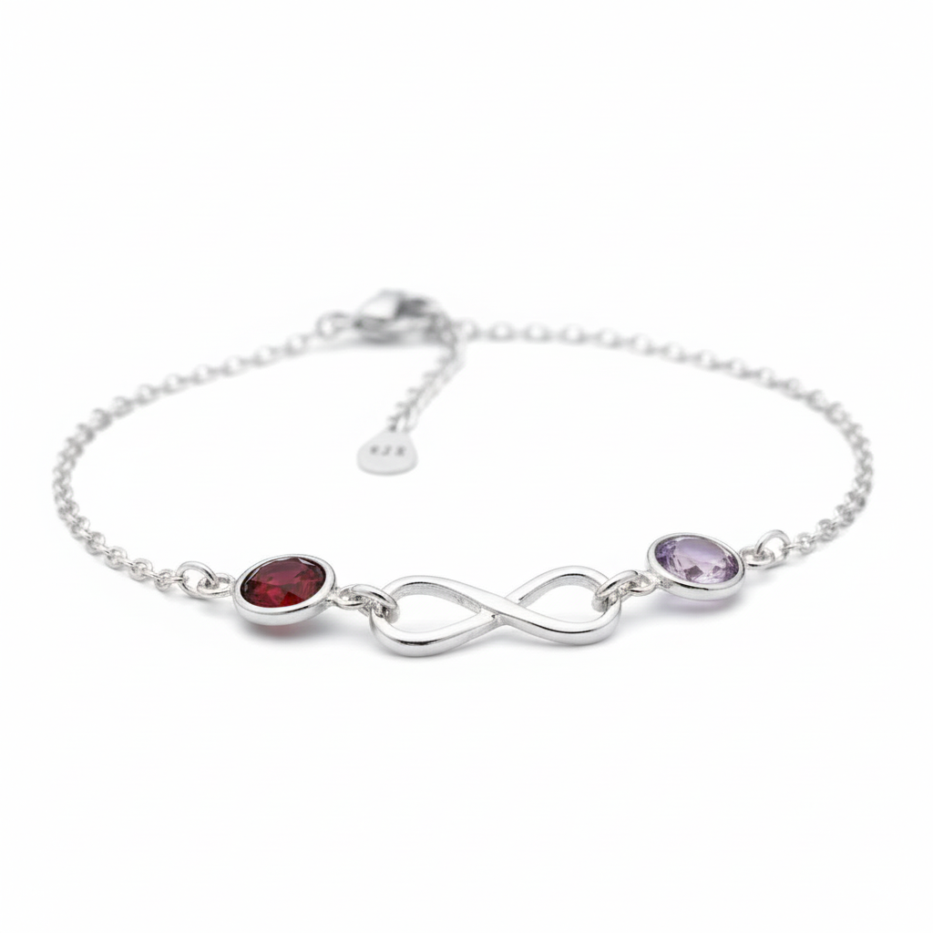 Silver bracelet with two gemstones on a white background
