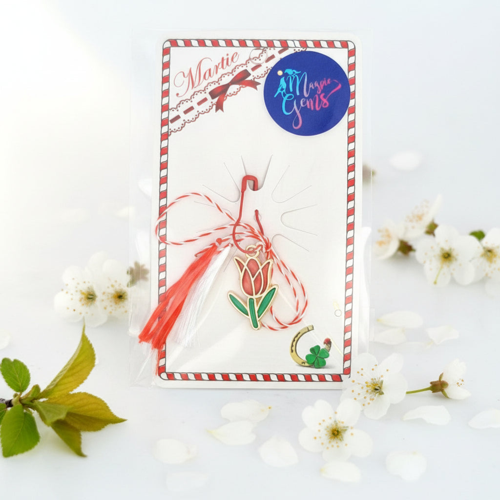 Packaged Tulip Martisor Charm Pendant on a Red and White bow with vibrant red and green enamelled tulip design and golden accents, perfect for celebrating the 1st of March traditions.