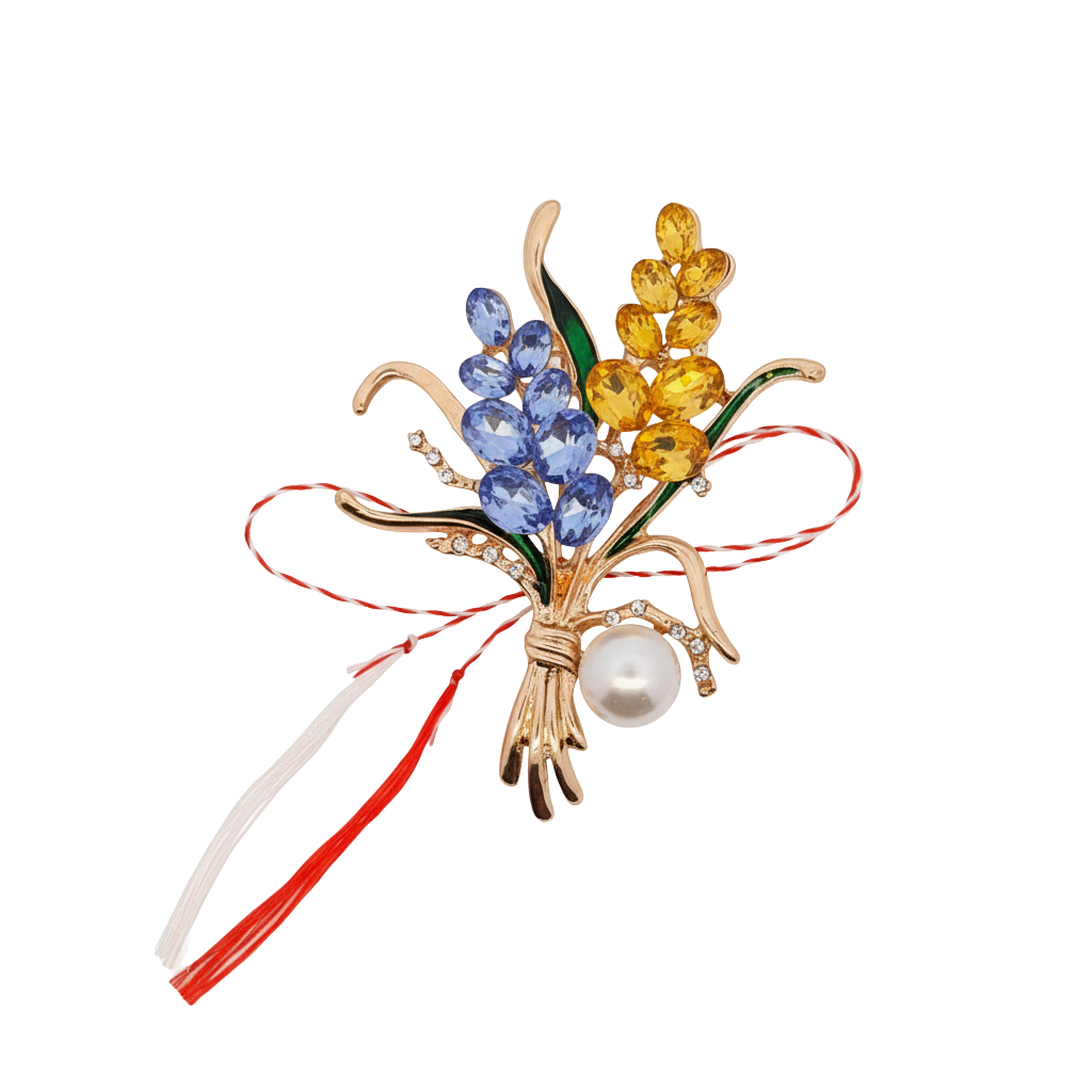 Yellow and Blue Lavender Martisor Brooch featuring sparkling gemstones, green enamelled leaves, a gold-toned bouquet design, and a lustrous pearl accent, paired with the traditional red and white Martisor bow to symbolise spring and renewal.