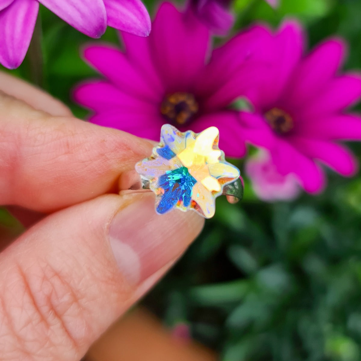 Aurora Borealis Edelweiss Crystal Ring in Nickel-Free Sterling Silver by Magpie Gems on a floral background