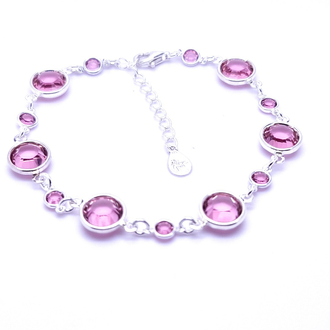 October birthstone sterling silver link bracelet, adorned with rose crystals to represent the opal birthstone, capturing the soft pink of dawn, meticulously handcrafted in Ireland.