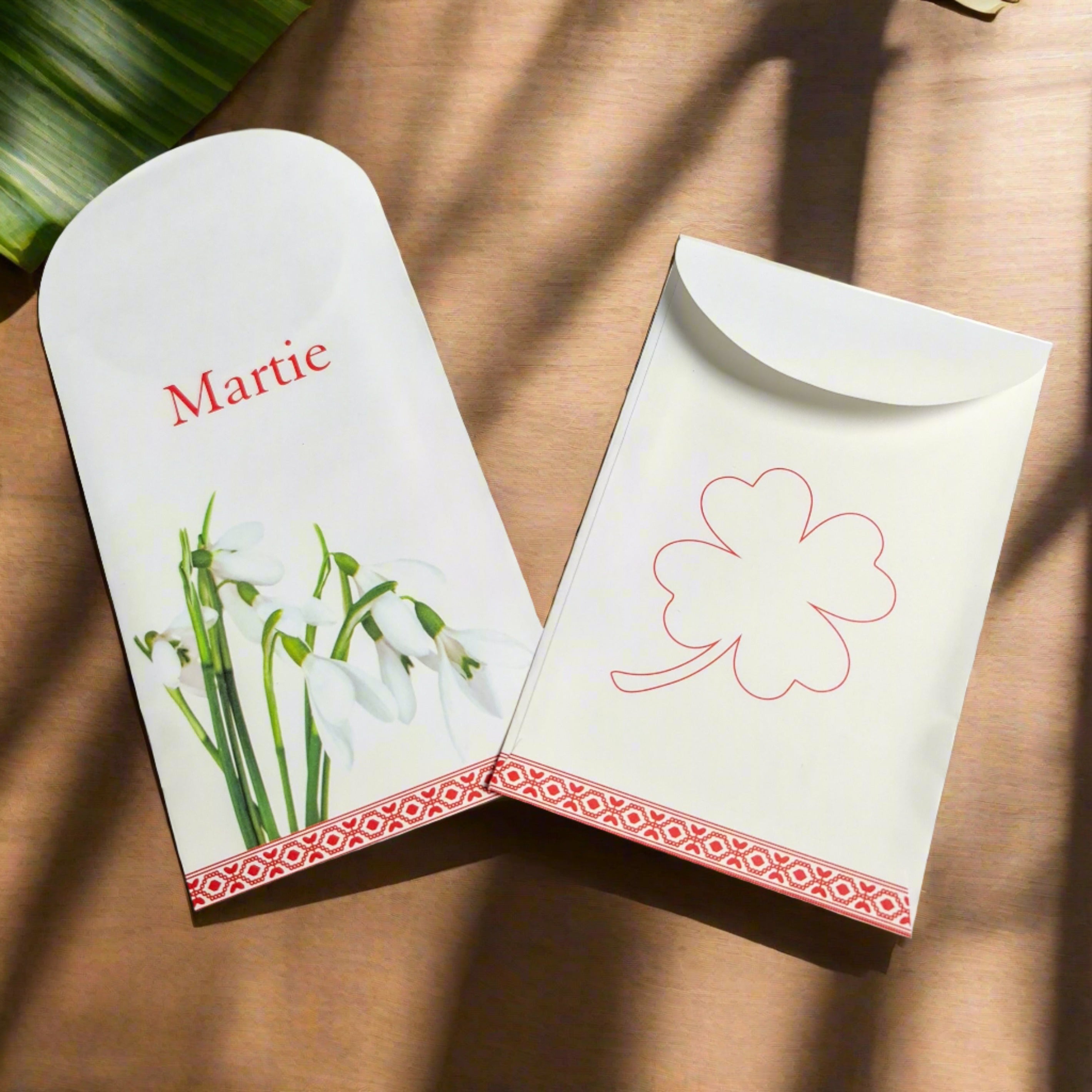 Paper envelope with snowdrops and clover, perfect for Martisor gift-giving.