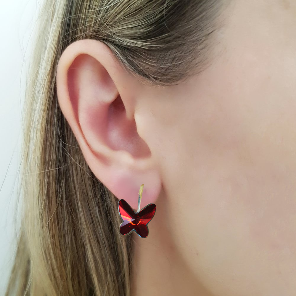 Elegant butterfly design, sparkling Austrian crystalstones, nickel-free sterling silver earrings. Perfect for sensitive ears. Gift box included. Colour Red Magma