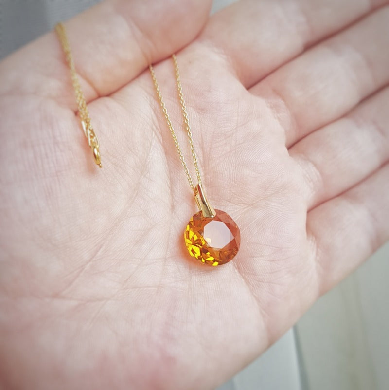 Detailed image of Topaz Round Chaton Pendant from November Elegance Set in 24k Gold Plated Sterling Silver.