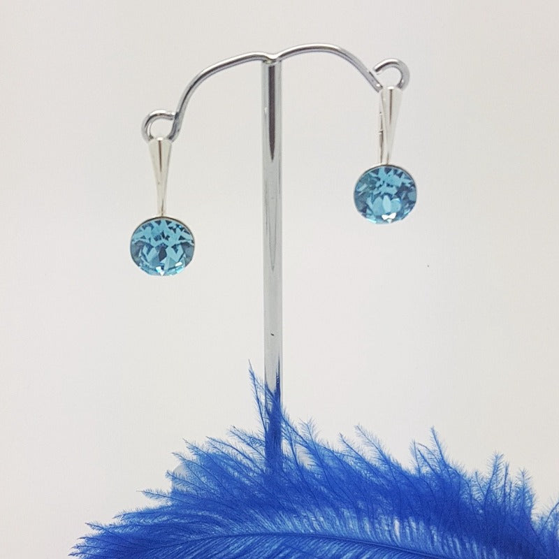 Aqumarine round stone silver earrings with secure lever back by magpie gems Ireland