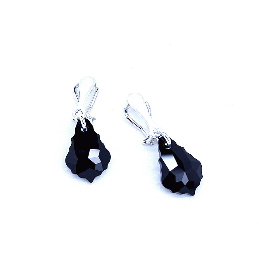 A pair of silver clip on earrings for women, made with Jet Black Baroque drop crystals, handmade in Ireland by Magpie Gems.