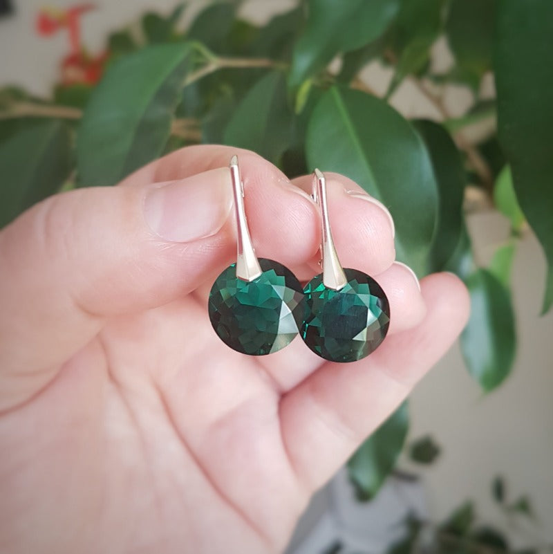 Sterling silver Emerald May birthstone drop earrings featuring green Austrian crystals in leverback hooks, handmade in Ireland.