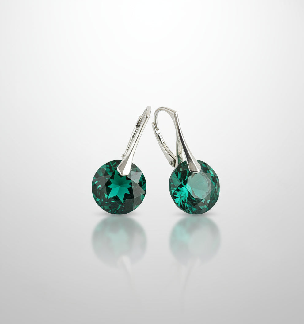 Sterling silver Emerald May birthstone drop earrings featuring green Austrian crystals in leverback hooks, handmade in Ireland.
