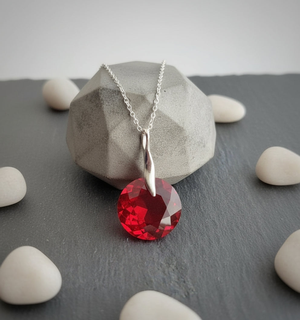 Light Siam red crystal July or Cancer birthstone necklace with 45cm sterling silver chain by Magpie Gems.