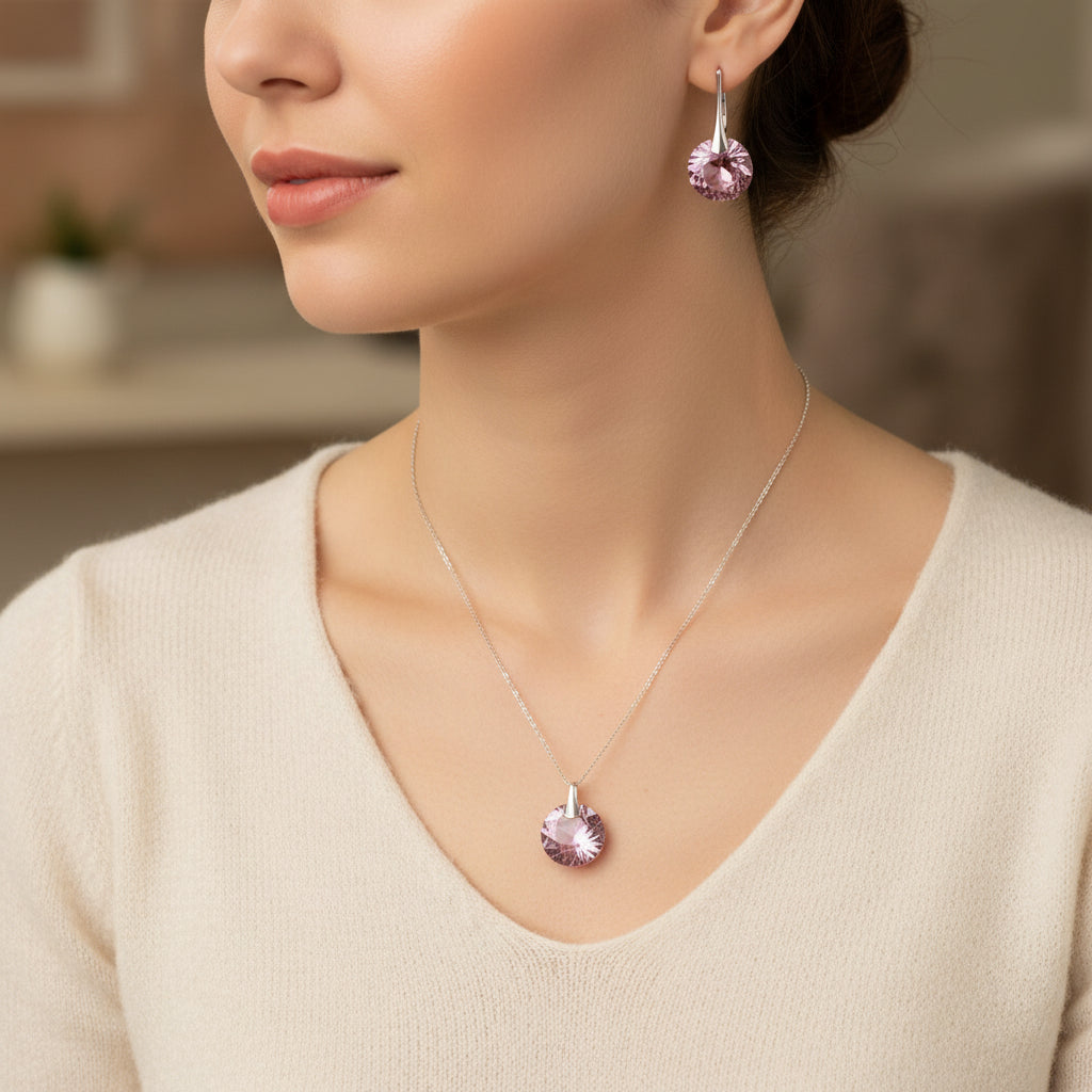 Woman wearing Rose October birthstone necklace and earrings in sterling silver, Libra-inspired crystal jewellery by Magpie Gems