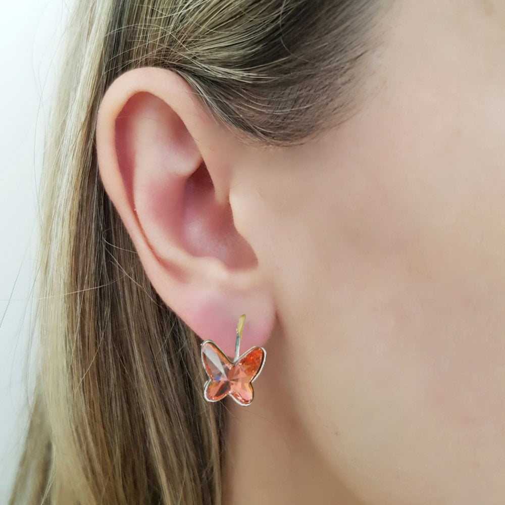 Elegant butterfly design, sparkling Austrian crystalstones, nickel-free sterling silver earrings. Perfect for sensitive ears. Gift box included. Colour Rose Peach
