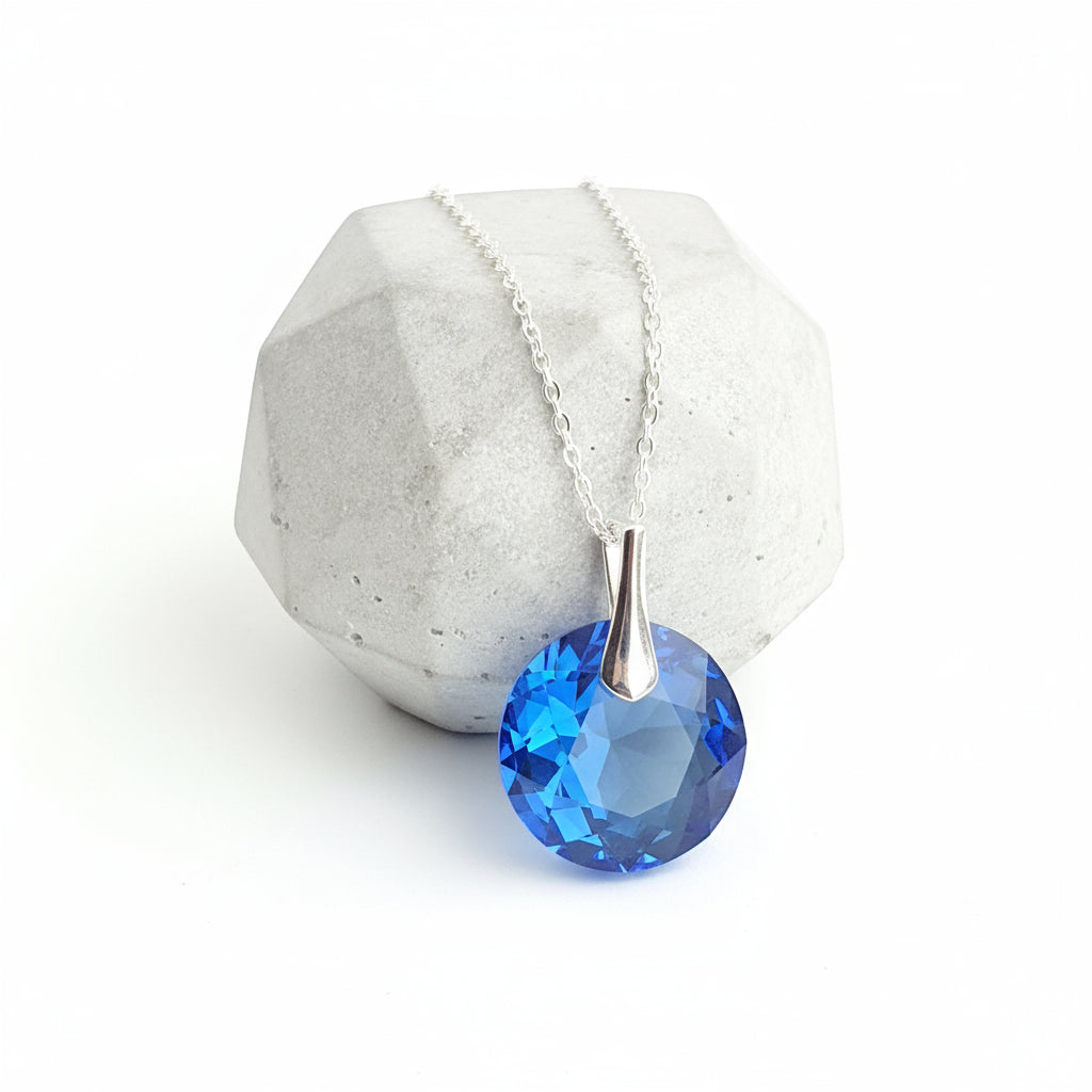 Sterling silver Sapphire blue 14mm crystal pendant for September Virgo birthstone by Magpie Gems.