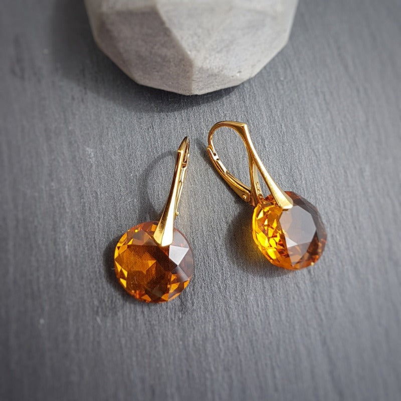 Close-up of November Elegance Topaz Earrings with 30mm drop and secure leverback in Sterling Silver (24k Gold Plated)..
