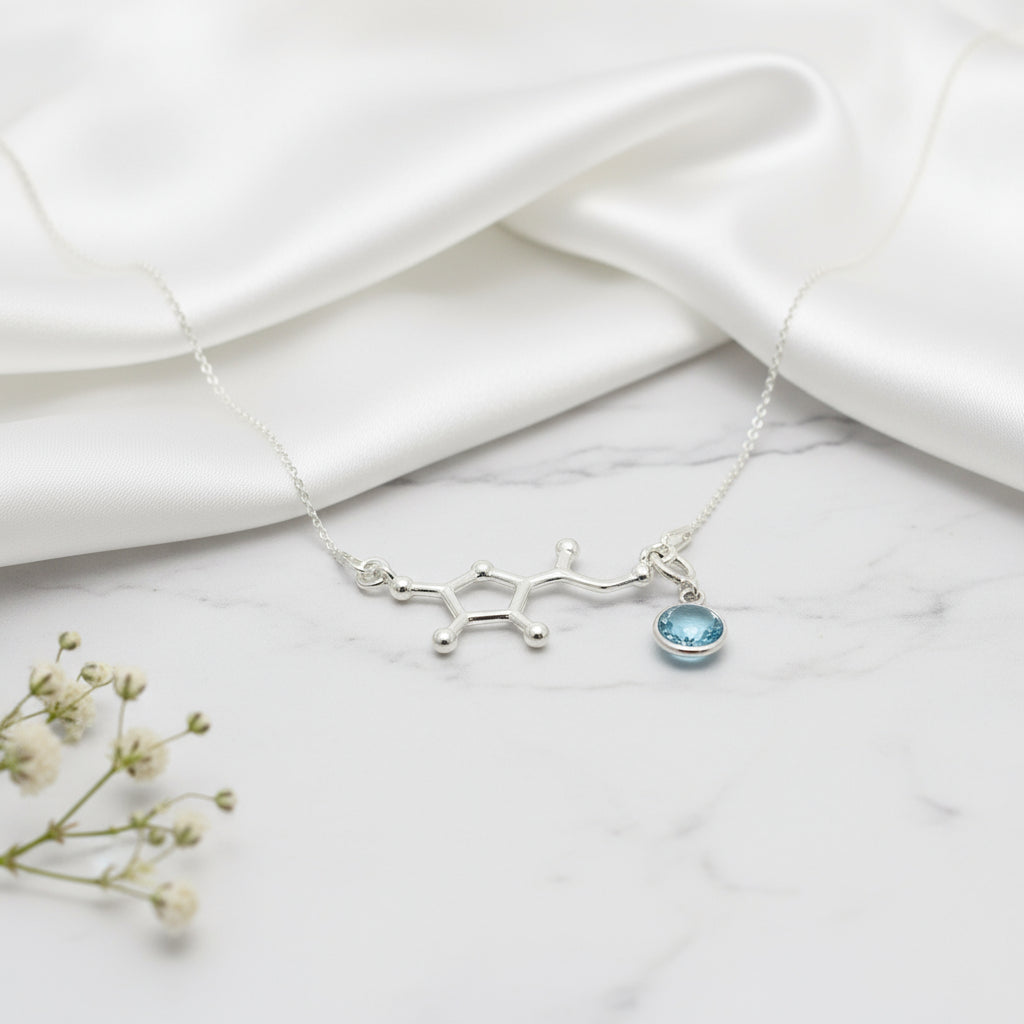 Handmade Vitamin C molecule necklace in sterling silver with a removable March Aquamarine birthstone charm, Irish jewellery by Magpie Gems.