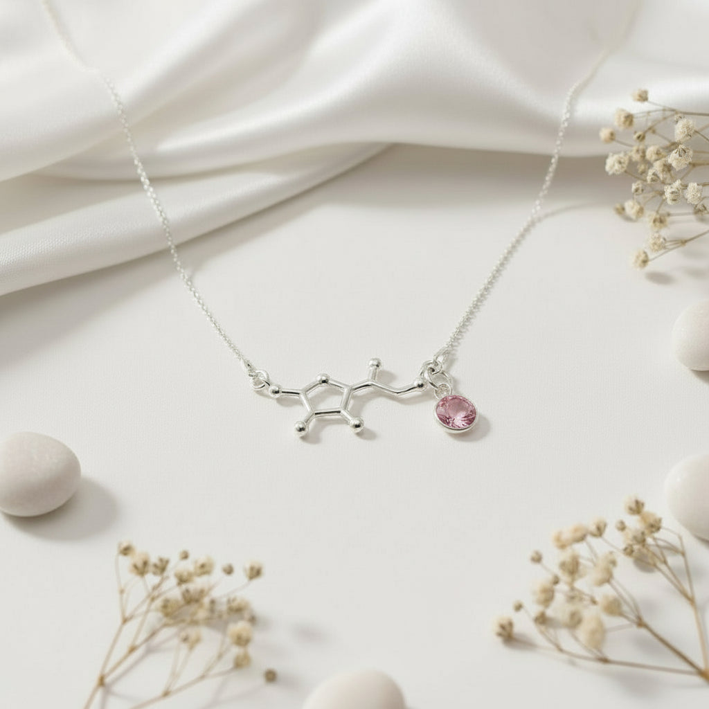 Sterling silver Vitamin C molecule pendant with a removable October Rose-coloured birthstone charm, handcrafted by Magpie Gems.